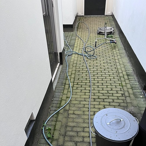 Straatwerk reiniging binnenplaats appartementencomplex Alkmaar Oktober 2022